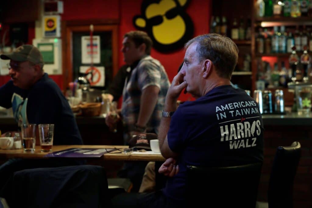 A supporter of Democratic presidential nominee Vice President Kamala Harris watches televised reports of the U.S. presidential election during a watch party in Taipei, Taiwan, Wednesday, Nov. 6, 2024. (Top Image/AP Photo/Chiang Ying-ying)